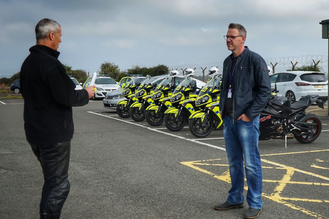PCC next to police motorbikes talking to officer