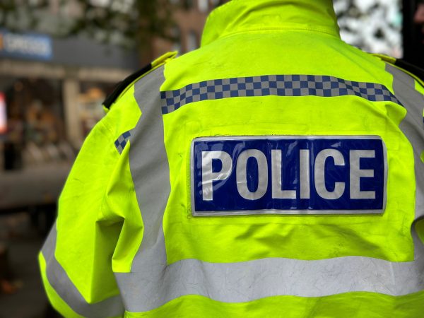 Yellow high vis jacket with Police on the back