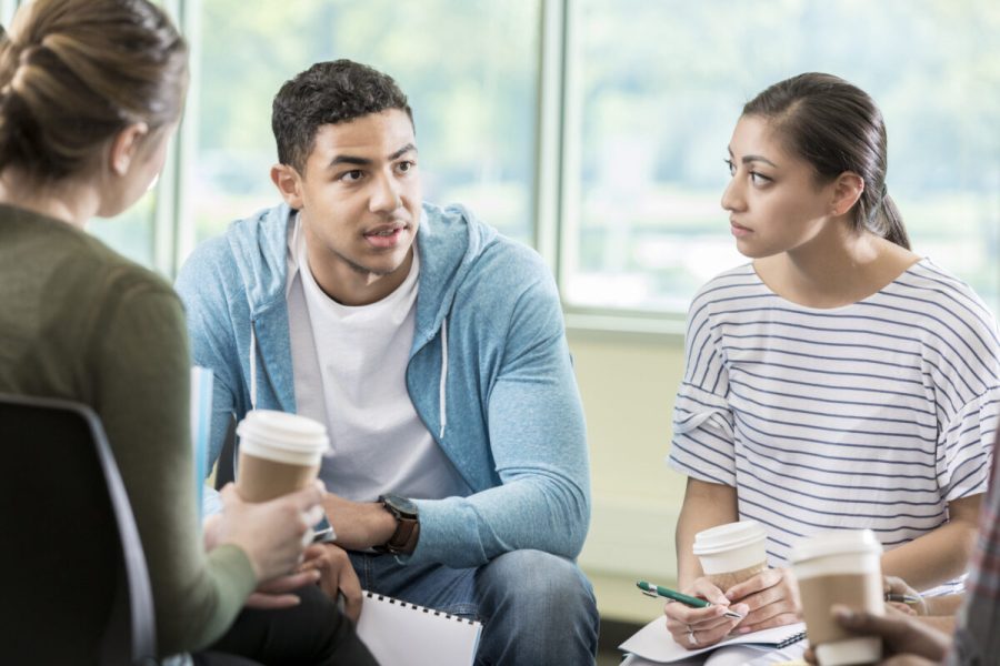 Young adults discuss issues during support group session